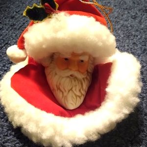 Ceramic Santa face head bust ornament with cloth and fur hat has holly and berry
